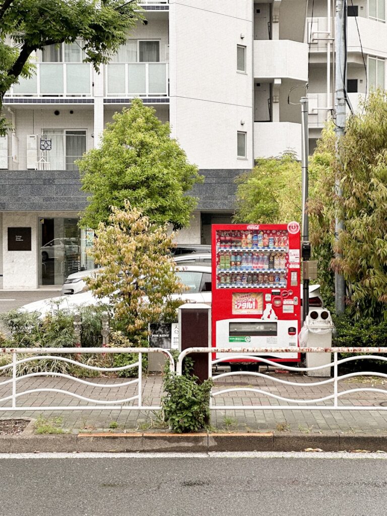 a vending machine sitting on the side of a road